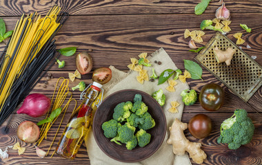 Top view of variety of organic natural fresh vegetables on wooden background with copy space