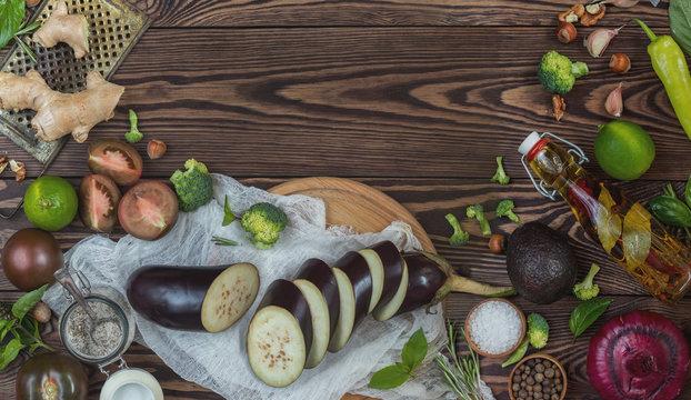 Top view of variety of organic natural fresh vegetables on wooden background with copy space