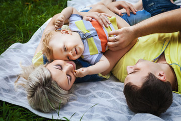 joyful family resting in park