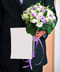 A beautiful wedding bouquet of roses in men's hands. Wedding