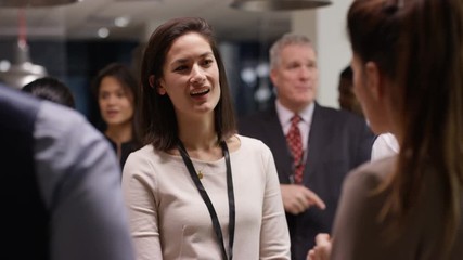  Diverse business group talking and networking at a business conference