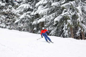 Man skiing down the extreme ski slope in alpine ski resort Borovets, Rila mountain, Bulgaria. 