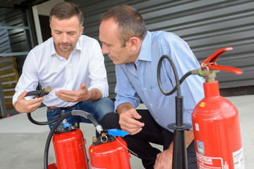 instructor explaining how to use fire extinguisher