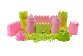 Castle made of kinetic sand isolated on white background