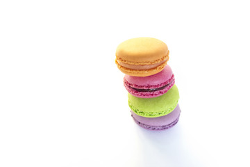 Colorful macaroons and blue meter tape, concept of healthy eating and nutrition