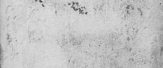 The panorama of the old grunge white wall concrete texture