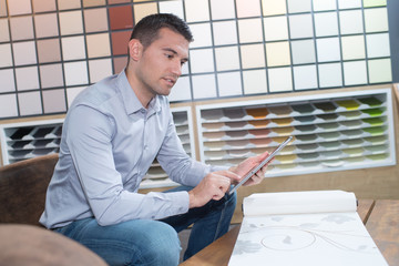 Man using tablet in decorating store