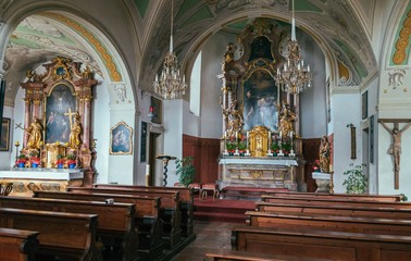 Fototapeta na wymiar Little catholic church of St. John's interior in Salzburg, Austria