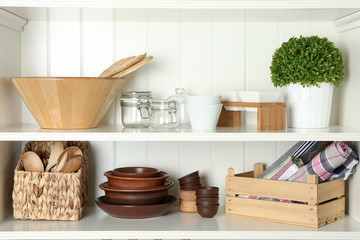 Different kitchenware on shelves