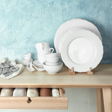 Set of tableware on wooden table