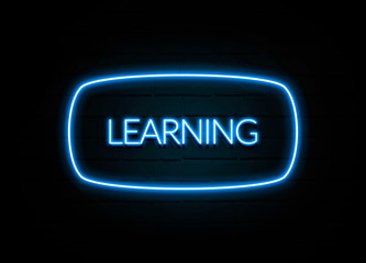 Learning  - colorful Neon Sign on brickwall