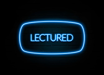 Lectured  - colorful Neon Sign on brickwall