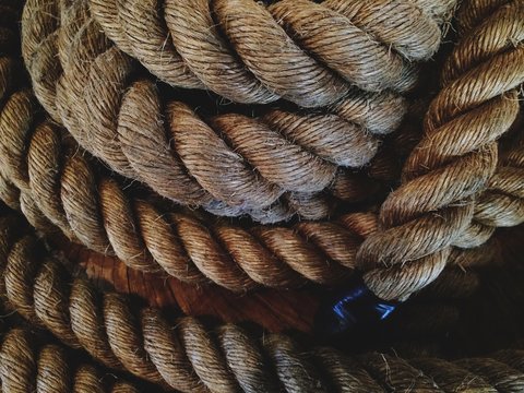 Pile of old thick nautical sailing rope cord