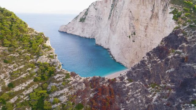Picturesque aerial view of greek Mediterranean islands with their blue waters, beaches and cliffs