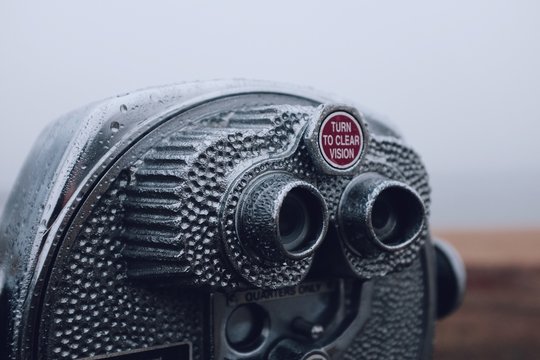 Binocular telescope camera on a foggy beach during the winter months in Maryland