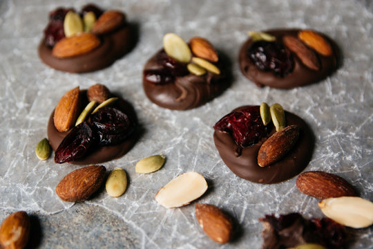 Chocolate topped with pumpkin seeds, cranberry and almonds