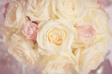 Close up on wedding flowers, bridal bouquet. Decoration made of roses over light celebration background