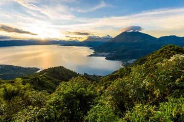 Fotobehang Vulkaan Sunrise in the morning at lake Atitlan, Guatemala - amazing panorama view to the volcanos San Pedro, Toliman and Atitlan  © Simon Dannhauer