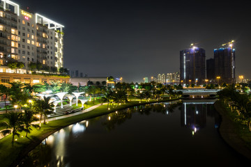 Fototapeta na wymiar Night at the District 2 of Ho Chi Minh City, Viet Nam. District 2 is a developing area and is a good place for foreigners to live.