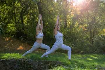 Womans doing yoga in nature