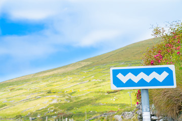 Wild Atlantic Way white on blue road sign on tourist route on Ireland's west coast.