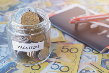 Australian money in VACATION jar with passport
