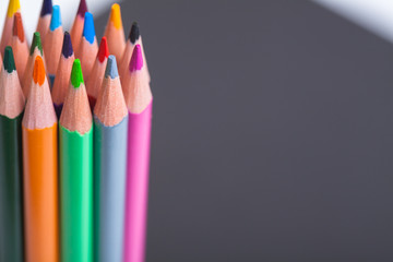 Wire color pencils. Bright colored pencils. Colored pencils on grey background with selective focus