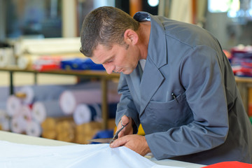 Man cutting fabric