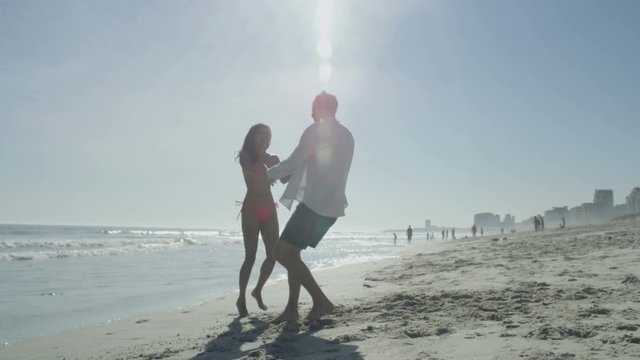  Romantic couple on vacation having fun together on beautiful beach
