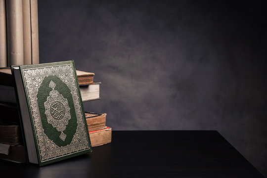 Koran - holy book of Muslims ( public item of all muslims ) on the table , still life