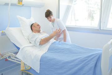 Obraz na płótnie Canvas nurse listening to patients request at the hospital
