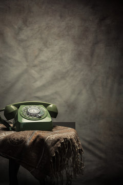 Vintage old phone on the table , still life