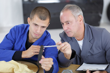 professor and student checking material resistance