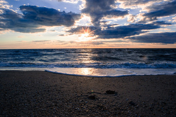 Fototapeta na wymiar dramatic beach sunset
