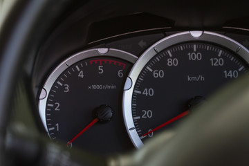 Close up of a speedometer in a car