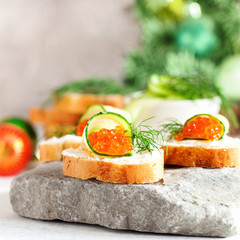 Sandwich with ricotta, a cucumber, caviar .