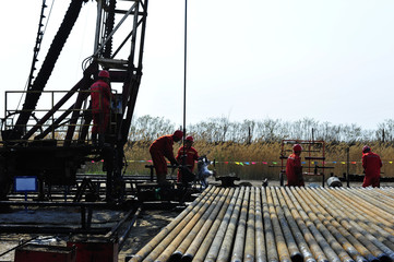 Oil field oil workers at work