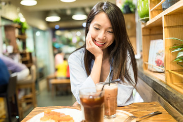 Woman enjoy the tea time in coffee shop