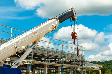 Truck and Crane in site for construction and blue sky 