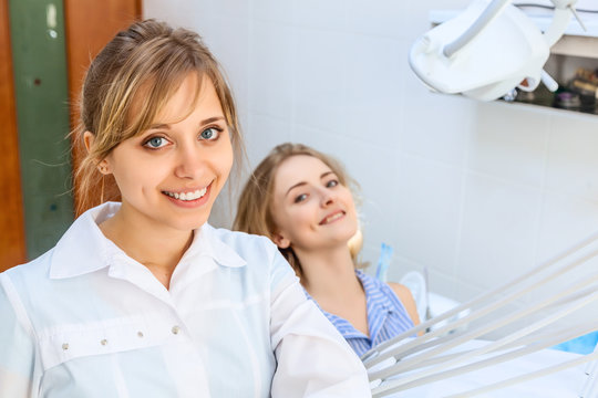 Young Professional Woman Dentist and Her Patient