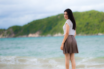 Fototapeta na wymiar Beautiful Asian woman vacation on beach of Thailand
