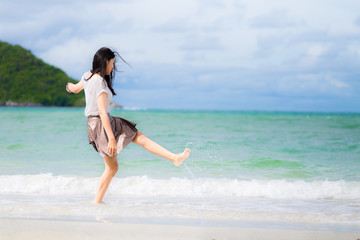 Beautiful Asian woman vacation on beach of Thailand