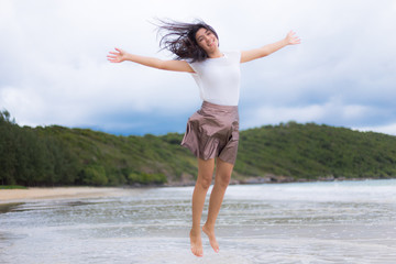 Beautiful Asian woman vacation on beach of Thailand