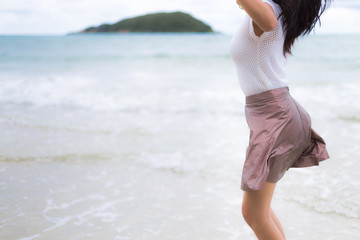 Beautiful Asian woman vacation on beach of Thailand