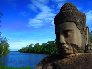 Buddha statue at the blue river side in South East Asia