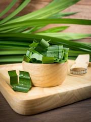 Pandan and pandan leaves in a wooden cup prepared for pandan juice or pandan cake to boil or dried Before going to cooking.