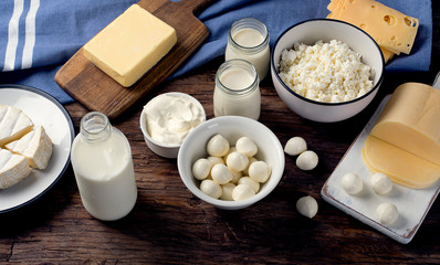 Dairy products on wooden background.
