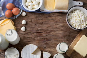 Dairy products on wooden background.