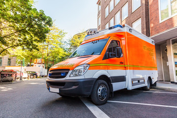 german ambulance car stands on parking lot