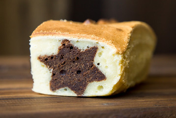 Surprise vanilla cake with a chocolate star inside. holidays concept